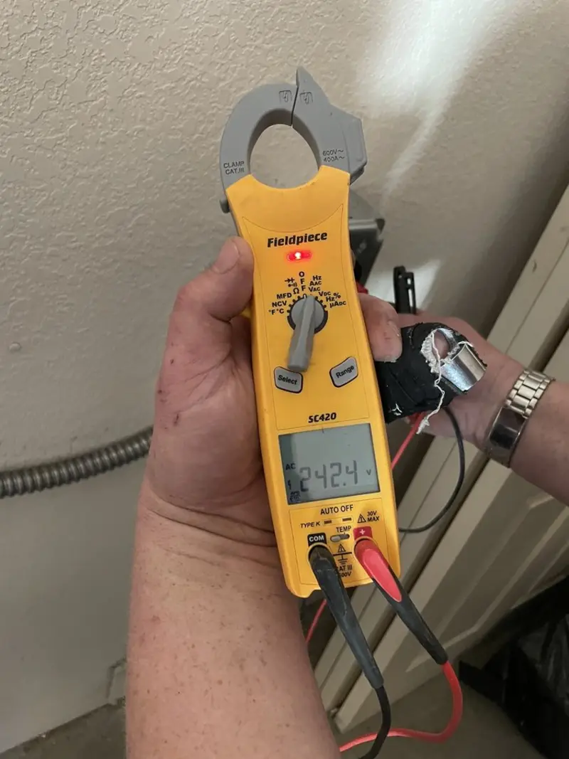 Voltage testing with clamp meter during Outlet Installation in Malta